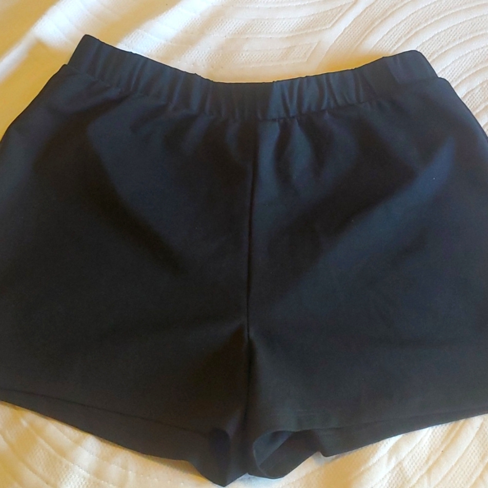 ASOS polyester black elastic waist dress shorts.